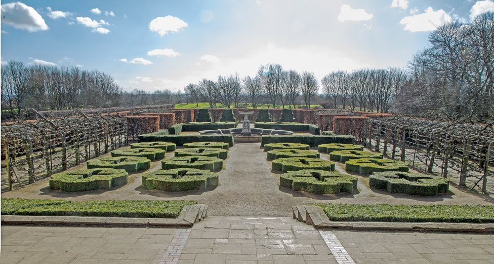 Traditional English knot garden outside of a stately home.